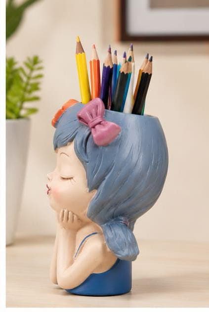 Handcrafted Resin Blue Hair Kissing Girl Face Pen Stand & Flower Planter Pot – Cute Head-on-Hands Girl Stationery Organizer with Pink Bow & Orange Flowers for Office Desk, Study Table & Gifting
